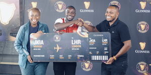 Christoper Omungala (centre) wins an all-expenses paid trip to the United Kingdom courtesy of Guinness. 