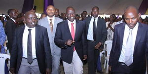 President William Ruto walks out of an event accompanied by Nandi senator, Samson Cherargei, Left