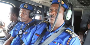 G Mutyambai (right) and his deputy Edward Mbugua (centre) on a helicopter in this undated picture