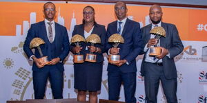 Co-op Bank Group holding trophies after being named Overall Winner at the 2023 Sustainable Finance Awards. 